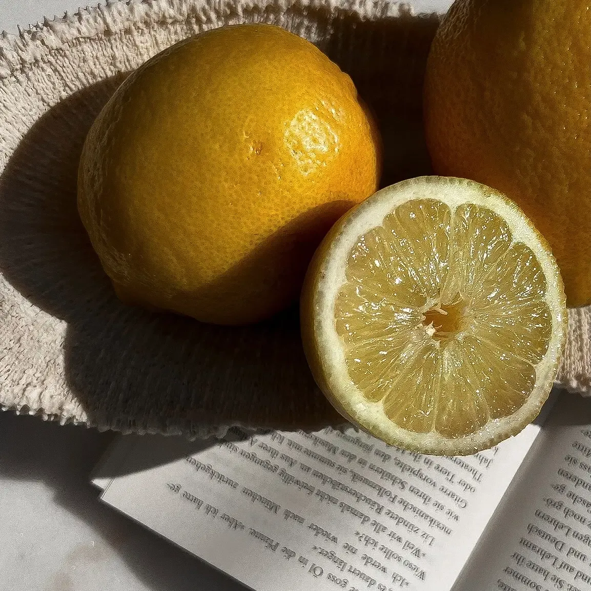 Sun shines on a bowl of lemons